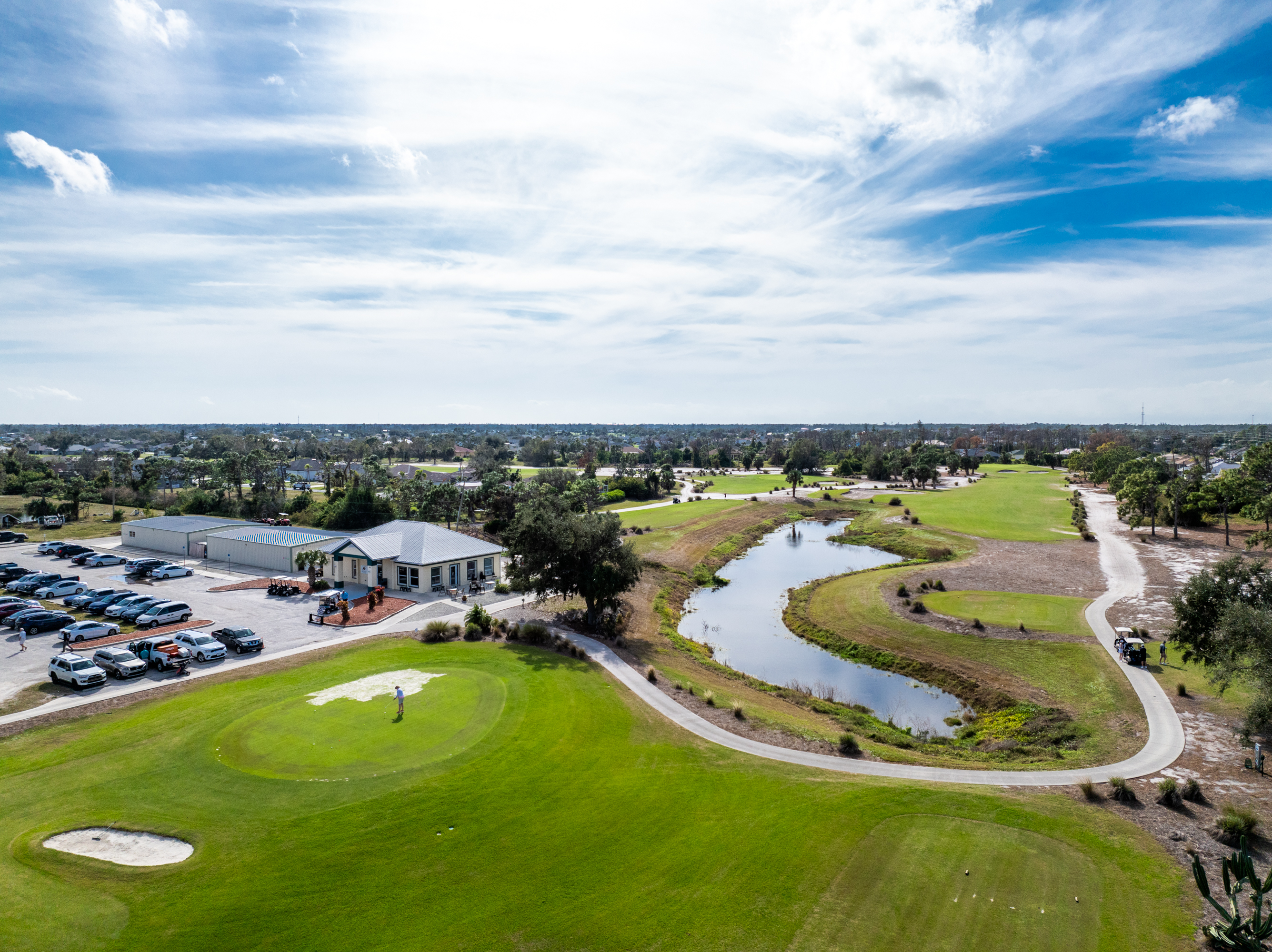 Aerial view of Pinemoor golf course, clubhouse and pond in Rotonda West